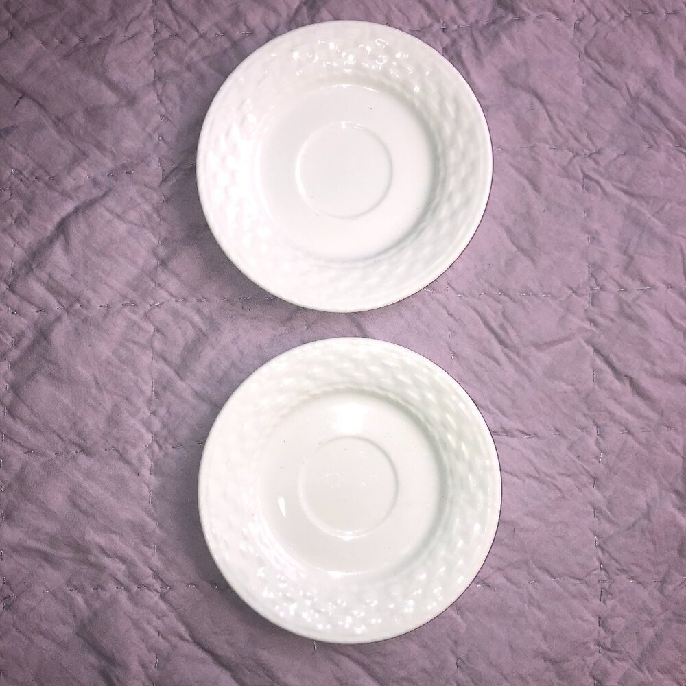 Two white ceramic Gibson Designs Sarasota saucers with basketweave pattern
